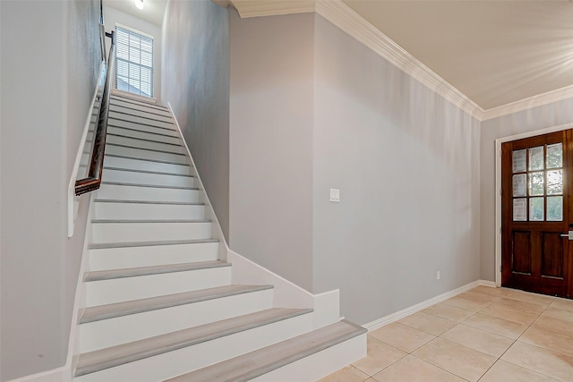 18306 S Austin Shore Dr, Cypress, TX 77433 - entrance foyer with healthy amount of natural light, stairway, crown molding, light tile patterned flooring, and baseboards