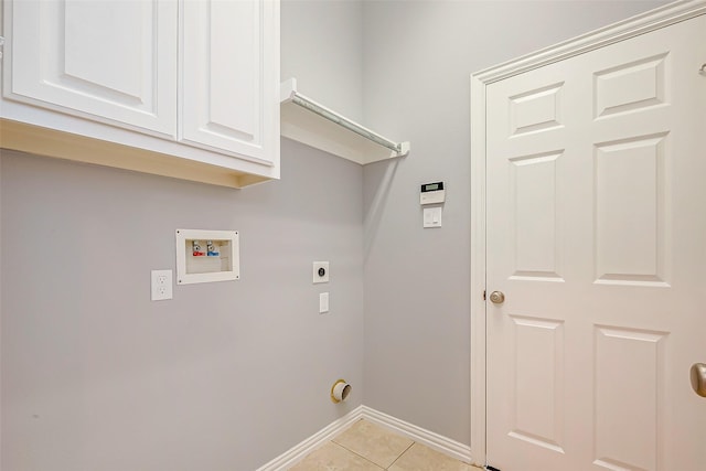 18306 S Austin Shore Dr, Cypress, TX 77433 - laundry area featuring washer hookup, electric dryer hookup, light tile patterned floors, baseboards, and cabinet space
