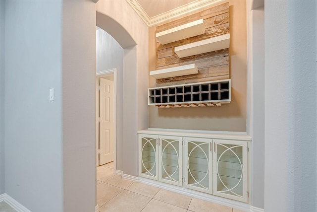 18306 S Austin Shore Dr, Cypress, TX 77433 - hall featuring tile patterned flooring, arched walkways, crown molding, and baseboards