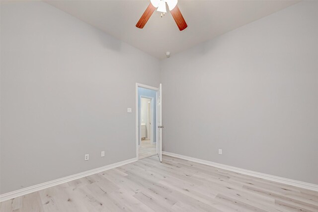 18306 S Austin Shore Dr, Cypress, TX 77433 - empty room with light wood-type flooring, ceiling fan, baseboards, and vaulted ceiling