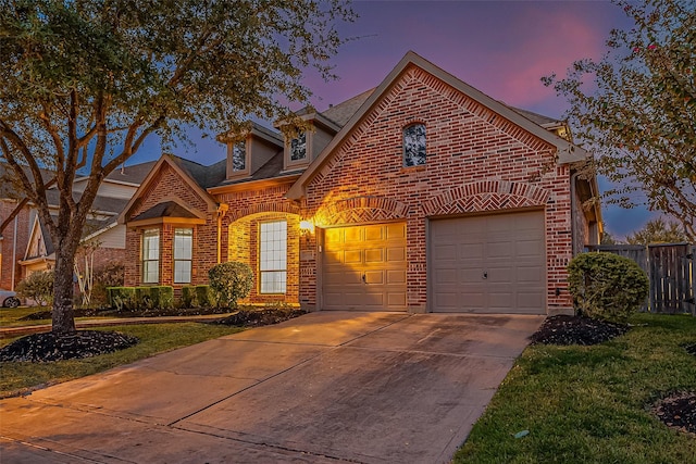 18306 S Austin Shore Dr, Cypress, TX 77433 - view of front of home with brick siding, concrete driveway, an attached garage, and roof with shingles