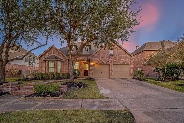 18306 S Austin Shore Dr, Cypress, TX 77433 - view of front facade with brick siding, concrete driveway, an attached garage, and fence