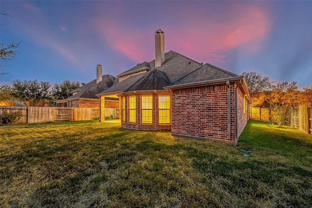 18306 S Austin Shore Dr, Cypress, TX 77433 - rear view of house with a chimney and brick siding