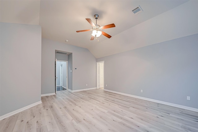 18306 S Austin Shore Dr, Cypress, TX 77433 - spare room featuring light wood-style flooring, a ceiling fan, baseboards, and vaulted ceiling