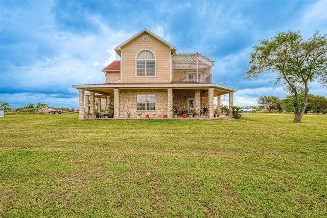 1241 Terrazas Ln, Sealy, TX 77474 - back of property featuring a lawn and stone siding