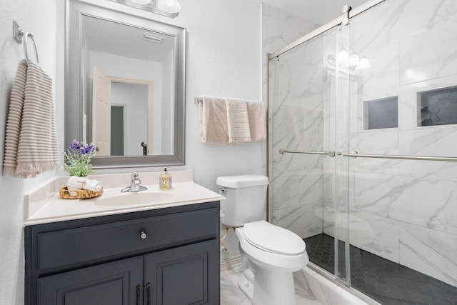 bathroom featuring toilet, vanity, a marble finish shower, and marble look tile flooring
