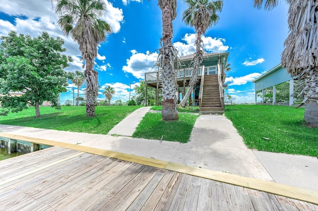 171 County Road 299, Sargent, TX 77414 - dock featuring stairs, a lawn, and a wooden deck