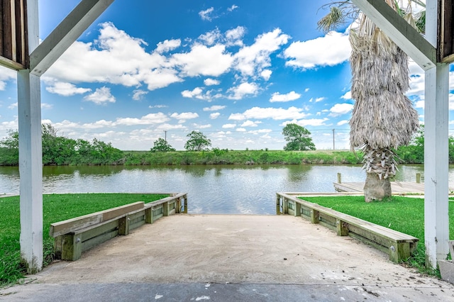171 County Road 299, Sargent, TX 77414 - dock featuring a boat ramp, a water view, and a lawn