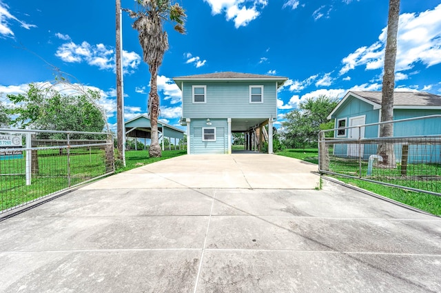 171 County Road 299, Sargent, TX 77414 - view of front facade featuring a carport and driveway