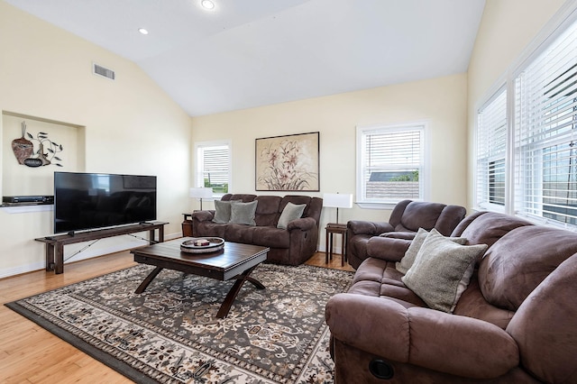 171 County Road 299, Sargent, TX 77414 - living room with vaulted ceiling, wood finished floors, healthy amount of natural light, and recessed lighting