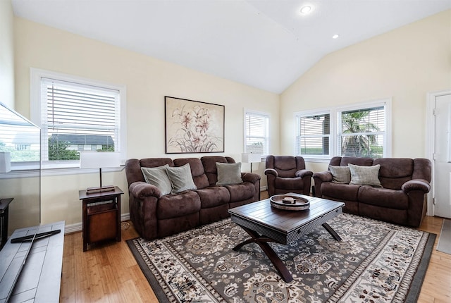171 County Road 299, Sargent, TX 77414 - living room with light wood-type flooring, vaulted ceiling, and recessed lighting
