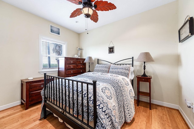 171 County Road 299, Sargent, TX 77414 - bedroom with baseboards, wood finished floors, and ceiling fan