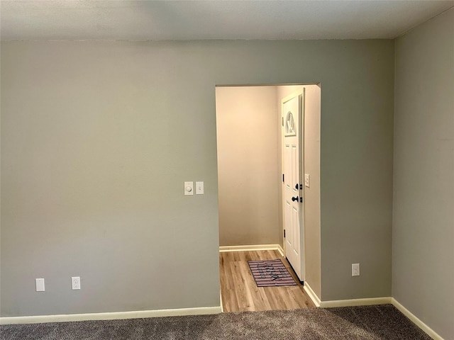 202 Spring Creek Loop, Livingston, TX 77351 - spare room featuring baseboards and carpet flooring