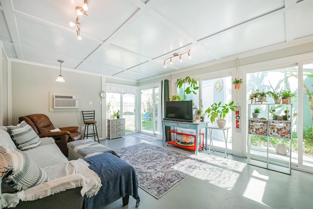 1902 Bayou Shore Dr, Galveston, TX 77551 - living room featuring concrete floors, plenty of natural light, a wall unit AC, and coffered ceiling