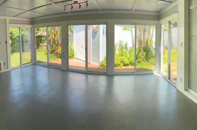 1902 Bayou Shore Dr, Galveston, TX 77551 - unfurnished sunroom with finished concrete floors and healthy amount of natural light