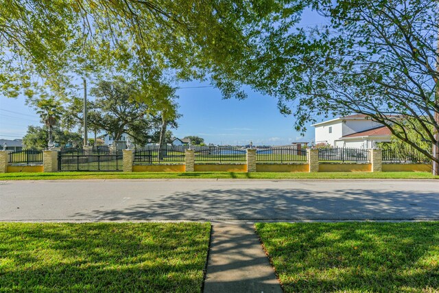 1902 Bayou Shore Dr, Galveston, TX 77551 - view of asphalt street featuring curbs