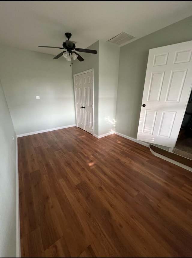 1902 Bayou Shore Dr, Galveston, TX 77551 - spare room featuring dark wood finished floors, ceiling fan, and baseboards