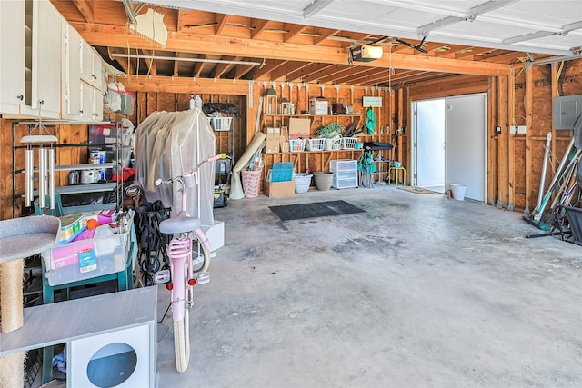 1902 Bayou Shore Dr, Galveston, TX 77551 - garage featuring a garage door opener and electric panel