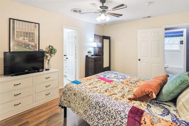 1902 Bayou Shore Dr, Galveston, TX 77551 - bedroom featuring wood finished floors, ensuite bathroom, and ceiling fan