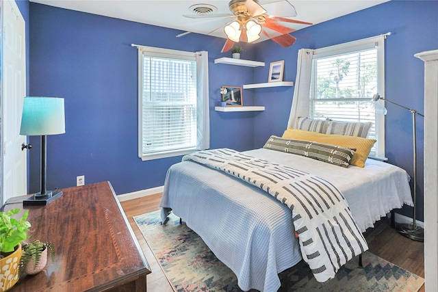 1902 Bayou Shore Dr, Galveston, TX 77551 - bedroom featuring wood finished floors and ceiling fan