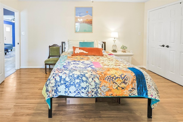 1902 Bayou Shore Dr, Galveston, TX 77551 - bedroom featuring light wood-type flooring and baseboards