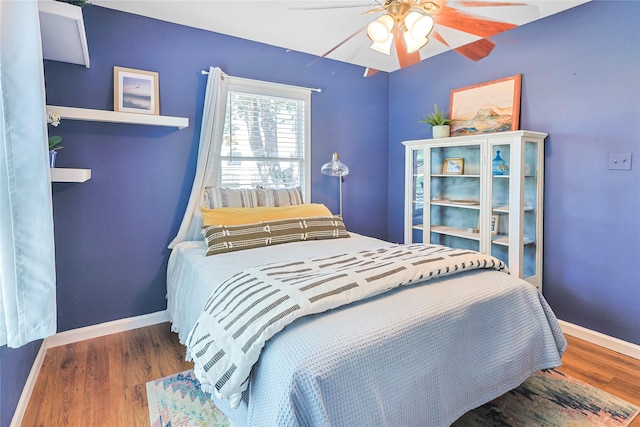 1902 Bayou Shore Dr, Galveston, TX 77551 - bedroom featuring wood finished floors and a ceiling fan