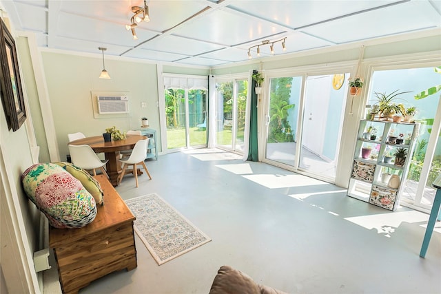 1902 Bayou Shore Dr, Galveston, TX 77551 - sunroom / solarium featuring plenty of natural light, an AC wall unit, and coffered ceiling