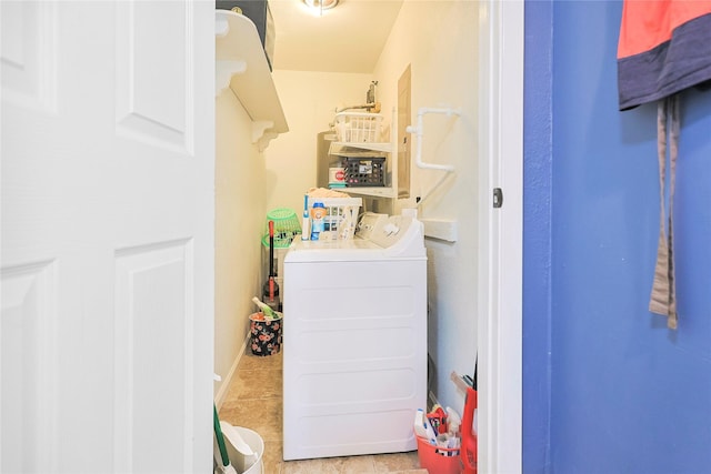 1902 Bayou Shore Dr, Galveston, TX 77551 - washroom with washer and clothes dryer and tile patterned flooring