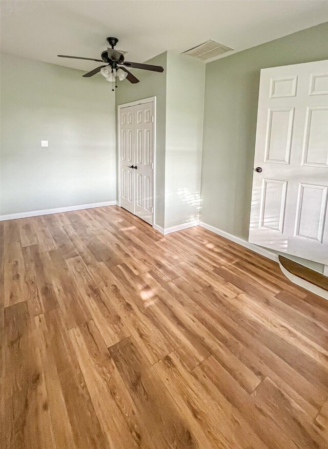 1902 Bayou Shore Dr, Galveston, TX 77551 - unfurnished room with light wood-style flooring and a ceiling fan