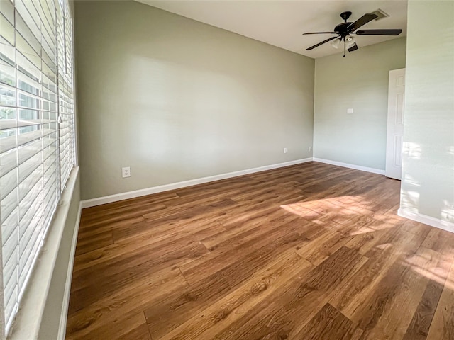 1902 Bayou Shore Dr, Galveston, TX 77551 - empty room with wood finished floors and a ceiling fan