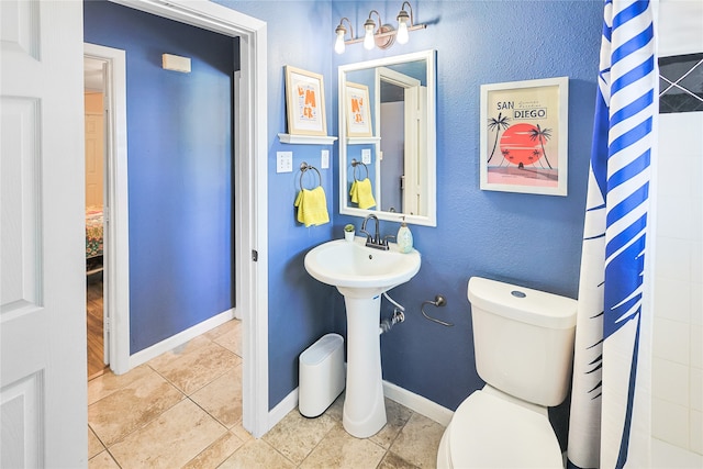 1902 Bayou Shore Dr, Galveston, TX 77551 - full bathroom featuring toilet and tile patterned flooring