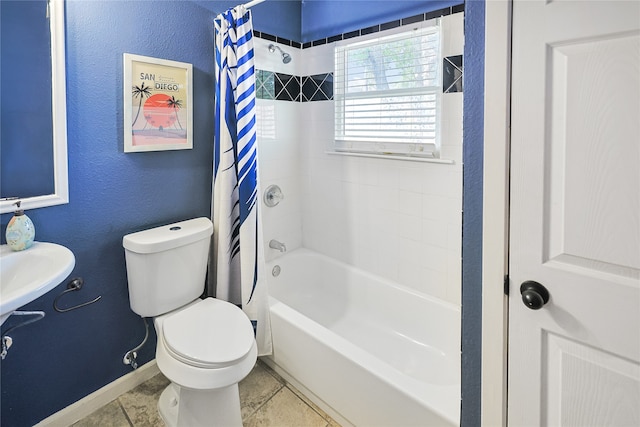 1902 Bayou Shore Dr, Galveston, TX 77551 - bathroom featuring shower / bath combo with shower curtain and tile patterned flooring