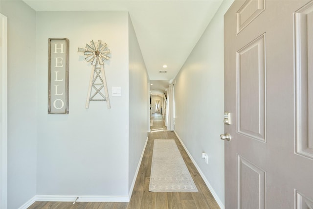 16953 Rich Pines Dr, Conroe, TX 77302 - hallway featuring light wood-style flooring, baseboards, and recessed lighting
