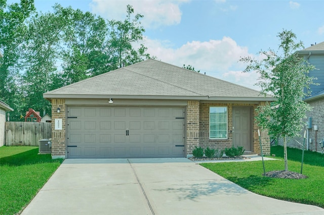 16953 Rich Pines Dr, Conroe, TX 77302 - single story home featuring brick siding, driveway, central air condition unit, an attached garage, and roof with shingles