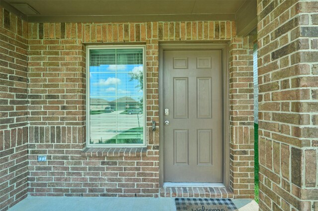 16953 Rich Pines Dr, Conroe, TX 77302 - property entrance featuring brick siding and covered porch