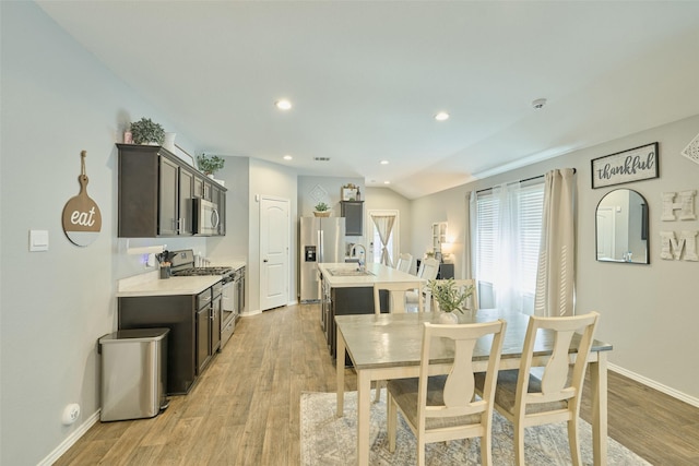 16953 Rich Pines Dr, Conroe, TX 77302 - dining area featuring baseboards, light wood-style floors, and recessed lighting