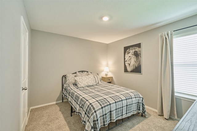 16953 Rich Pines Dr, Conroe, TX 77302 - bedroom featuring carpet floors and baseboards