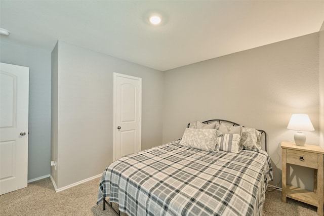 16953 Rich Pines Dr, Conroe, TX 77302 - bedroom featuring light colored carpet and baseboards