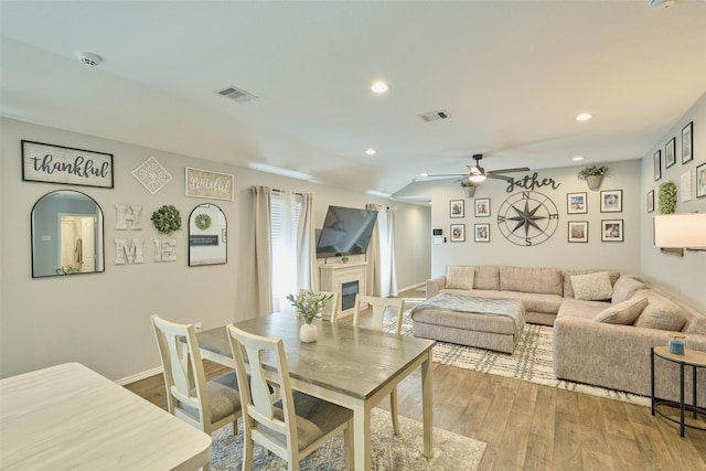16953 Rich Pines Dr, Conroe, TX 77302 - living area featuring ceiling fan, wood finished floors, a fireplace, recessed lighting, and baseboards