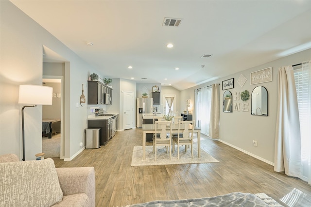 16953 Rich Pines Dr, Conroe, TX 77302 - dining area featuring baseboards, light wood-style floors, and recessed lighting
