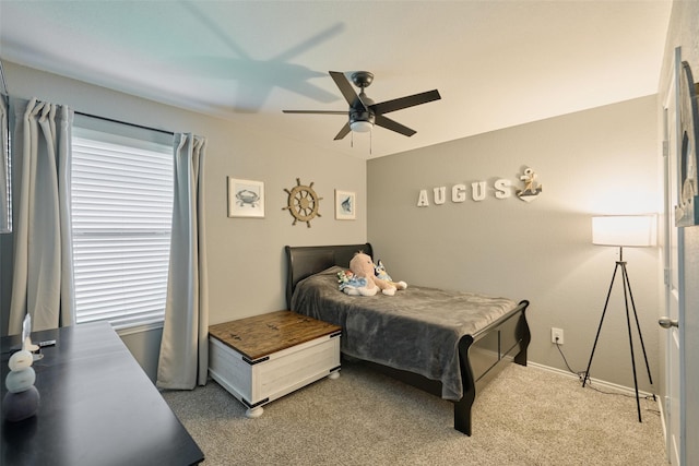 16953 Rich Pines Dr, Conroe, TX 77302 - bedroom featuring light carpet, a ceiling fan, and baseboards
