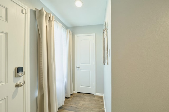 16953 Rich Pines Dr, Conroe, TX 77302 - corridor with light wood-type flooring and baseboards