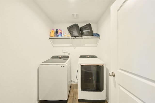 16953 Rich Pines Dr, Conroe, TX 77302 - laundry area with separate washer and dryer and wood finished floors