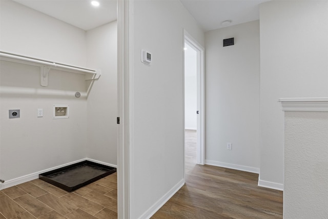 1214 Sabine Brook Way, Houston, TX 77073 - laundry room with wood finished floors, washer hookup, hookup for an electric dryer, hookup for a gas dryer, and baseboards