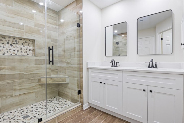 1214 Sabine Brook Way, Houston, TX 77073 - full bathroom featuring a shower stall, double vanity, and wood tiled floors