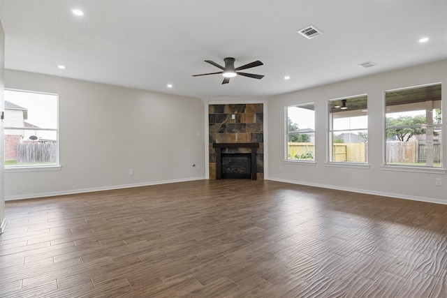 1214 Sabine Brook Way, Houston, TX 77073 - unfurnished living room featuring ceiling fan, dark wood-style flooring, recessed lighting, a tiled fireplace, and baseboards