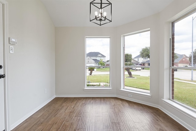 1214 Sabine Brook Way, Houston, TX 77073 - unfurnished dining area featuring wood finished floors, a chandelier, and baseboards