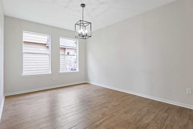 1214 Sabine Brook Way, Houston, TX 77073 - unfurnished room with a chandelier, wood finished floors, and baseboards