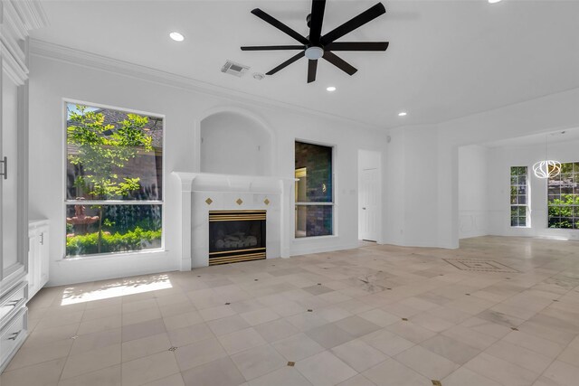 24 Stonegate Park Ct, Spring, TX 77379 - unfurnished living room with ceiling fan, ornamental molding, healthy amount of natural light, a tiled fireplace, and recessed lighting