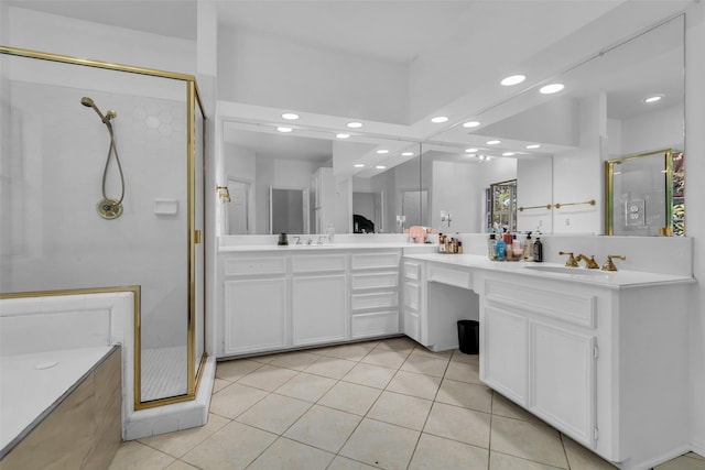 24 Stonegate Park Ct, Spring, TX 77379 - full bathroom with recessed lighting, a shower stall, double vanity, and tile patterned floors